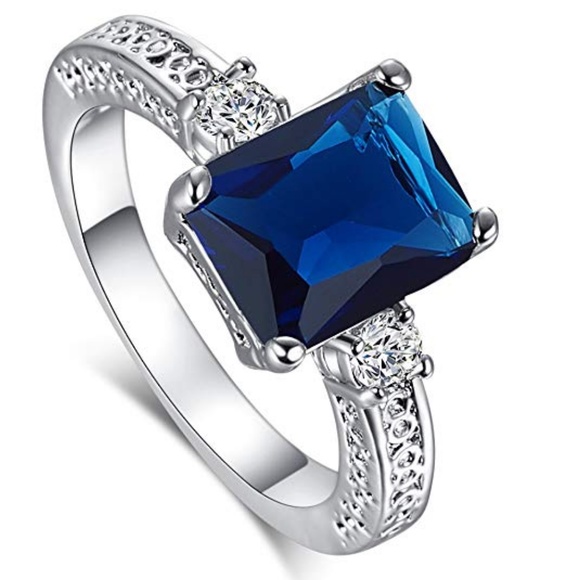 C.C. Boutique Jewelry - NWT  Sterling Silver Emerald Cut Blue Topaz Ring
